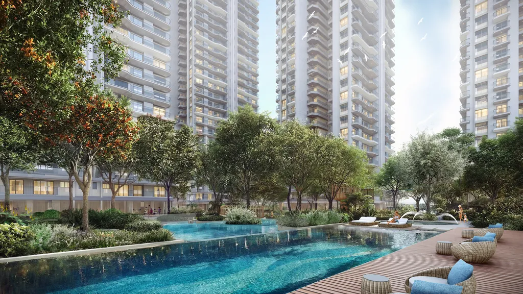 A pool at Eldeco 7 Peaks set between landscaped greens and the towers